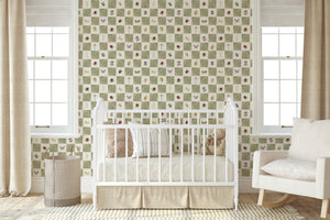 Jude wallpaper by Curate Space in soft green, insects on a soft check in a nursery with a white cot and armchair
