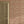 Little Freya wallpaper by Curate Space in soft pink, small abstract flowers and leaves in a hallway beside a panelled door