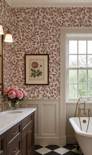 Marni wallpaper by Curate Space in rust orange, sweeping leafy vines in a bathroom with a freestanding bath and framed botanical print