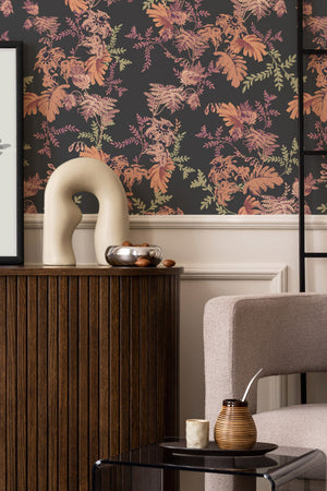 Mina wallpaper by Curate Space in midnight blue, dramatic layered florals and foliage in a living room with a wooden sideboard and a sculptural vase