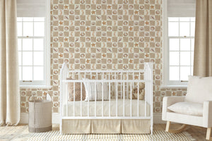 Molly wallpaper by Curate Space in beige, seashells and seahorses on a check in a nursery with a white cot