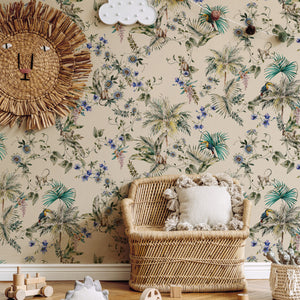 Noah wallpaper by Curate Space in pebble grey, palm trees, tropical foliage and animals in a nursery with a wicker chair and a rattan sun mirror