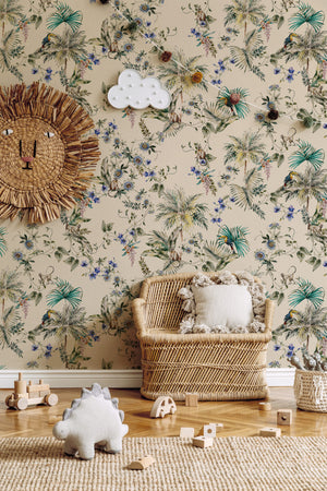 Noah wallpaper by Curate Space in pebble grey, palm trees, tropical foliage and animals in a nursery with a wicker chair and a rattan sun mirror