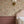 Nola wallpaper by Curate Space in off-white, wildflowers and tall stems in a bedroom with pink panelling and a brass wall sconce