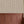 Ren wallpaper by Curate Space in off-white, wavy stripes with bugs and butterflies above red panelling