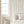 Ren wallpaper by Curate Space in off-white, wavy stripes with bugs and butterflies in a white nursery with a cot and a window