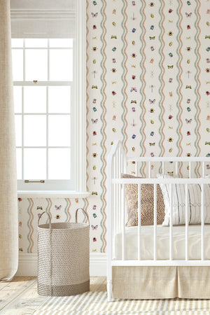 Ren wallpaper by Curate Space in off-white, wavy stripes with bugs and butterflies in a white nursery with a cot and a window