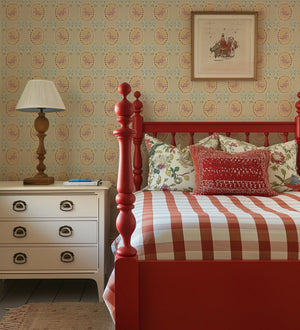 Flying Horse of the Silk Road wallpaper by Annika Reed in pink, flying horses in medallions behind a bed