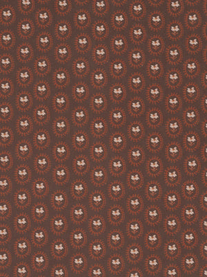 Folly wallpaper by Parker and Jules in brown, flat sample of small sunburst medallions