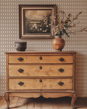 Harlequin Parade wallpaper by Annika Reed in beige, a small harlequin check behind a console table