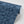 Indigo Nui wallpaper by Tatie Lou in indigo blue, roll showing nui shibori dots