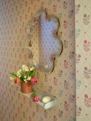 Jaipur wallpaper by Parker and Jules in pink, block-print flowers on a trellis in a hallway
