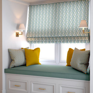 Kit Moon linen by Annika Reed in blue and green, crescent moons in a lattice as a roman blind