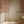 Lace wallpaper by Dami and Em Design in coral, a lace pattern in an entryway