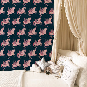 Pegasus wallpaper by Annika Reed in navy and pink, winged horses behind a sofa in a living room