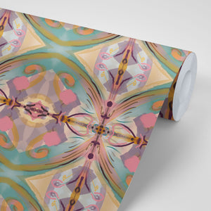 Franny wallpaper by Tatie Lou in pink and green, partly unrolled roll showing a kaleidoscopic floral