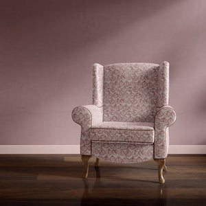 Pomegranate velvet by Annika Reed in pink, pomegranates upholstered on an armchair