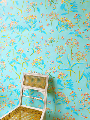 The Last Dance wallpaper by Claire de Quénetain in pink and blue, a hand-painted floral design in a styled room setting