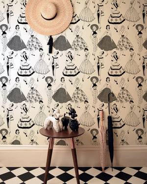 Vintage Dress wallpaper by Dupenny in black and white, 1950s dresses in a styled room setting