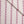 Wild Flower linen by Bethie Tricks in red and blue, vertical stripes of dragonfly-like motifs with a fold of fabric across the corner